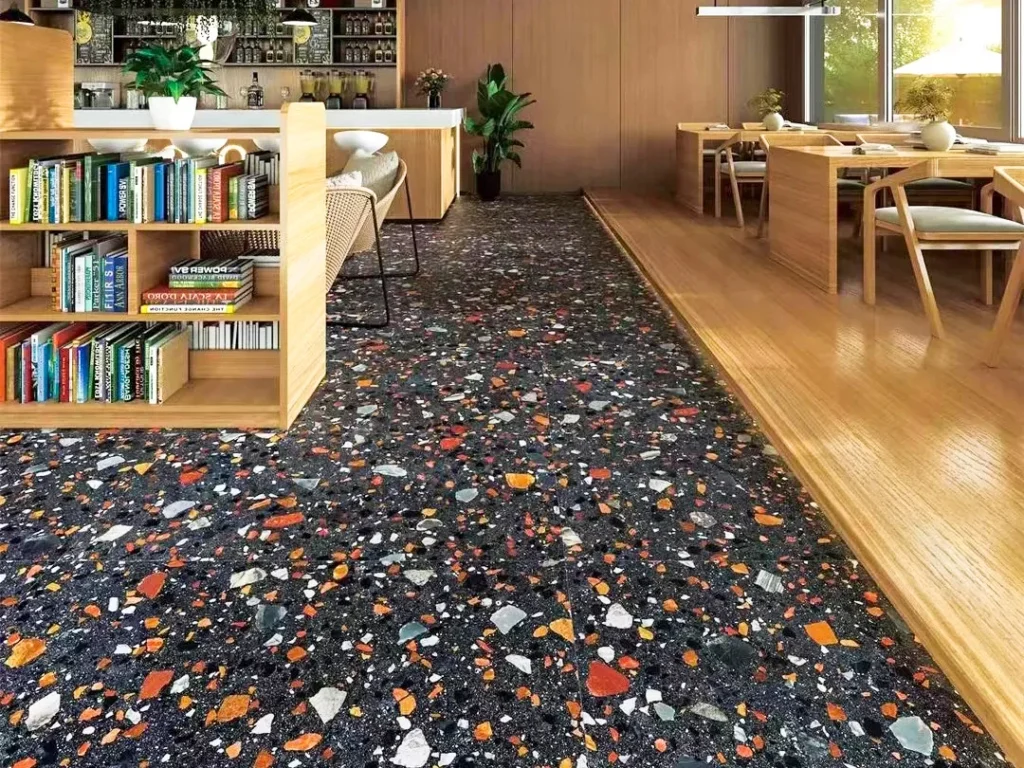 piastrelle terrazzo colori misti, pavimento terrazzo fondo scuro aggregati multicolori per ristorante e libreria, terrazzo inorganico per spazi pubblici