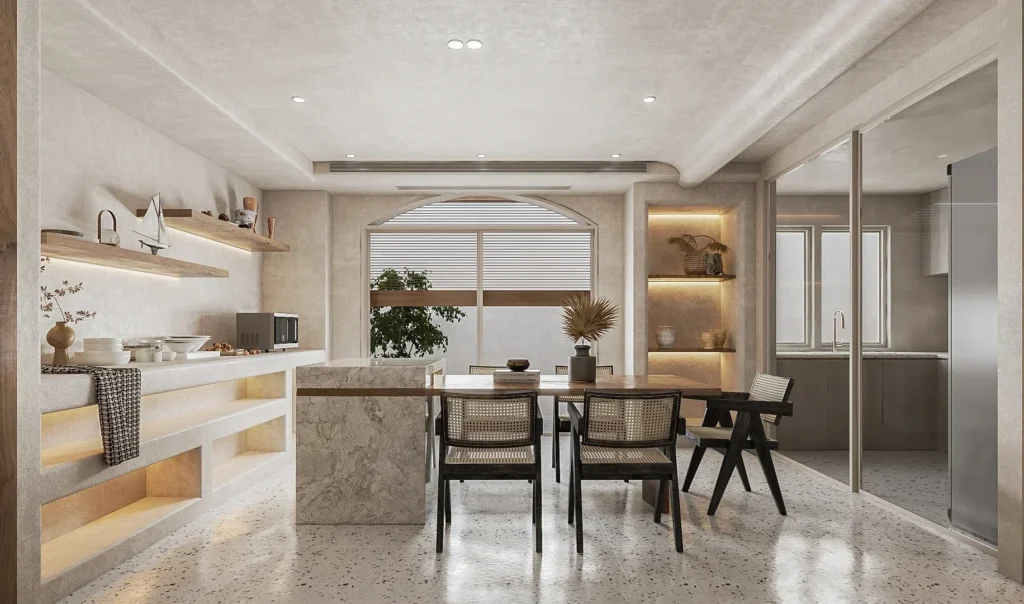 Come scegliere le piastrelle in terrazzo: cucina-sala da pranzo in stile wabi-sabi con pavimento in terrazzo chiaro a granulometria sottile, sedie in vimini, isola in marmo, intonaco cementizio e archi in cartongesso, per un look naturale e opaco.